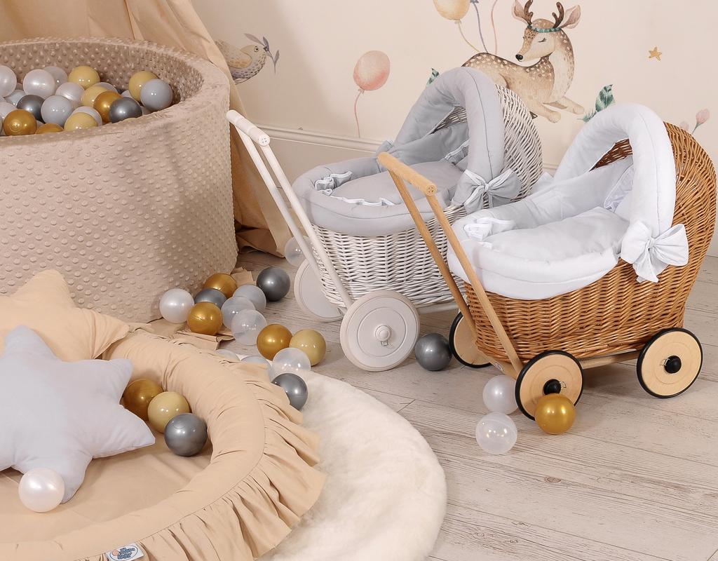White wicker pushchair for dolls with gray bedding and soft lining