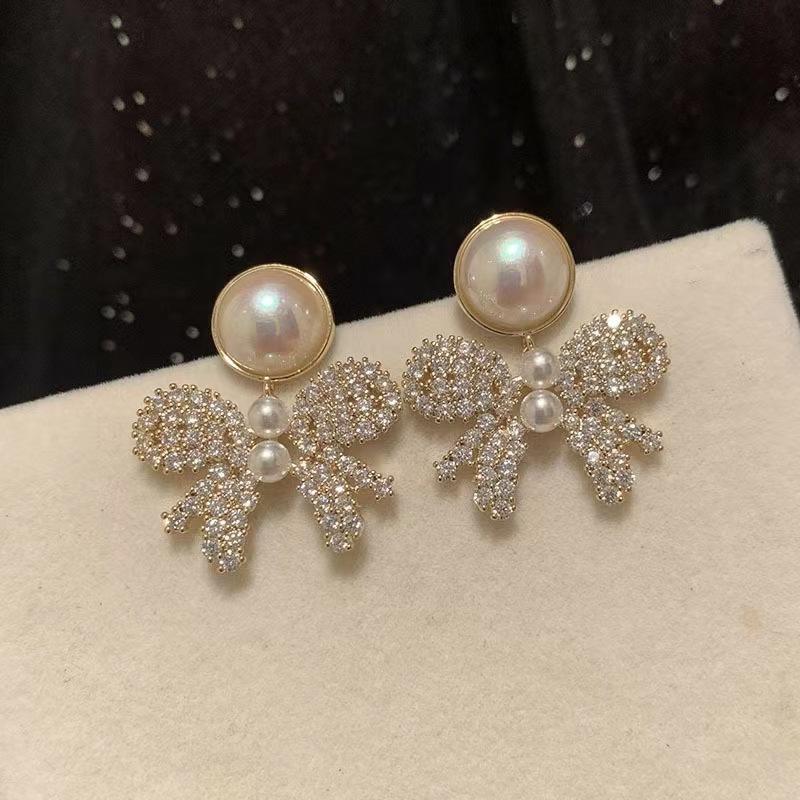 Temperamental Women's Hollow Out Bowknot Zirconia Earrings Dangling Ladies Pearl Earrings Exquisite Generous Ear Jewelry