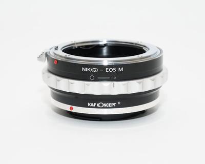 КОНЦЕПТ Адаптер для объектива Nikon F mount G на крепление Canon EOS M с салфеткой для чистки линз K&F ng-eosm (КФЕОСМ)
