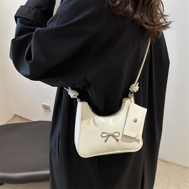 Сумка-мешок с бантом подмышкой женская 2024 новая простая сумка-ведро для поездок на работу высококачественная фактурная сумка-мессенджер через плечо tide