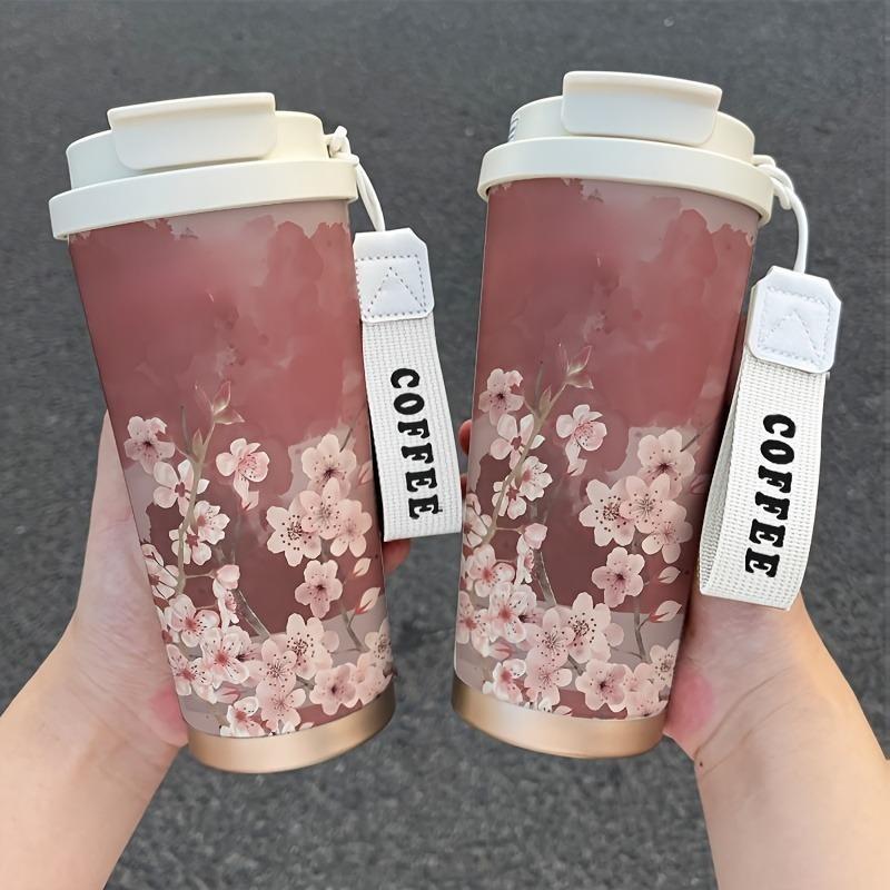 17.92oz cherry blossom insulated cup, leak-proof with straw, portable for hot and cold drinks.