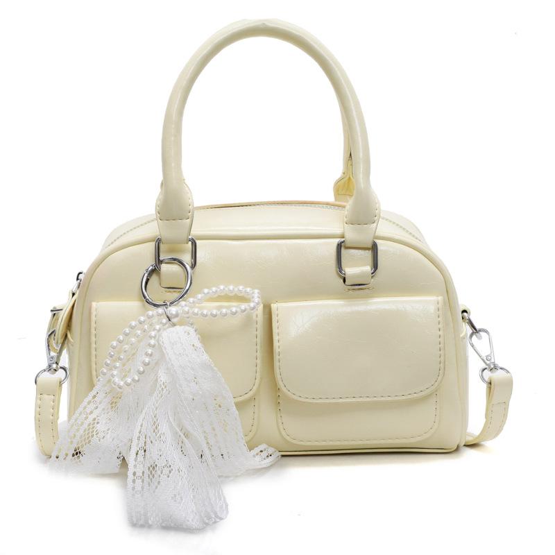 Корейская версия популярной весенне-летней дофаминовой простой портативной сумки-бостонки, нишевая повседневная сумка-мессенджер в иностранном стиле для通勤, женская