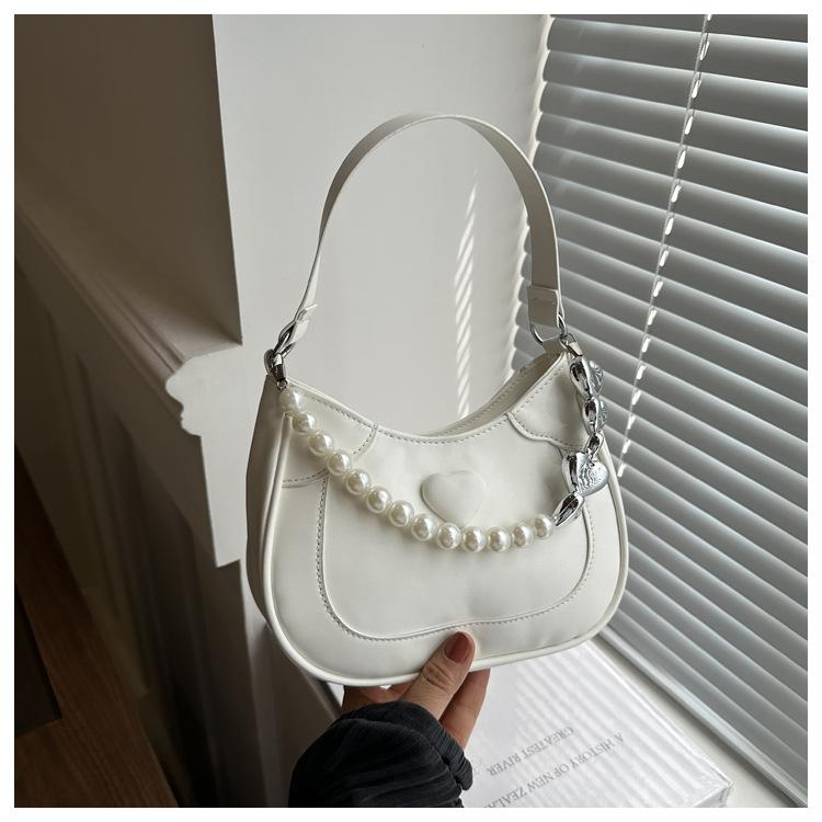 Жемчужная сумочка женская 2024 новая трендовая корейская нишевая сумка подмышку премиальная иностранная сумка-мессенджер сумка на плечо
