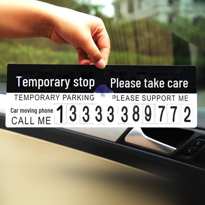 Знак временной парковки с номером телефона и карточкой с сообщением