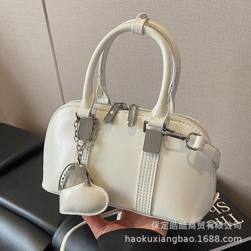 Корейская версия нишевый дизайн простой и универсальный портативный сумка-мессенджер для поездок на работу женская весна 2025 новая модная повседневная сумка-мессенджер