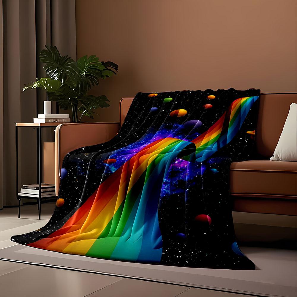 A flowing rainbow ribbon amidst colorful planets and a starry cosmic backdrop. for all seasons blanket lunch break throw gift