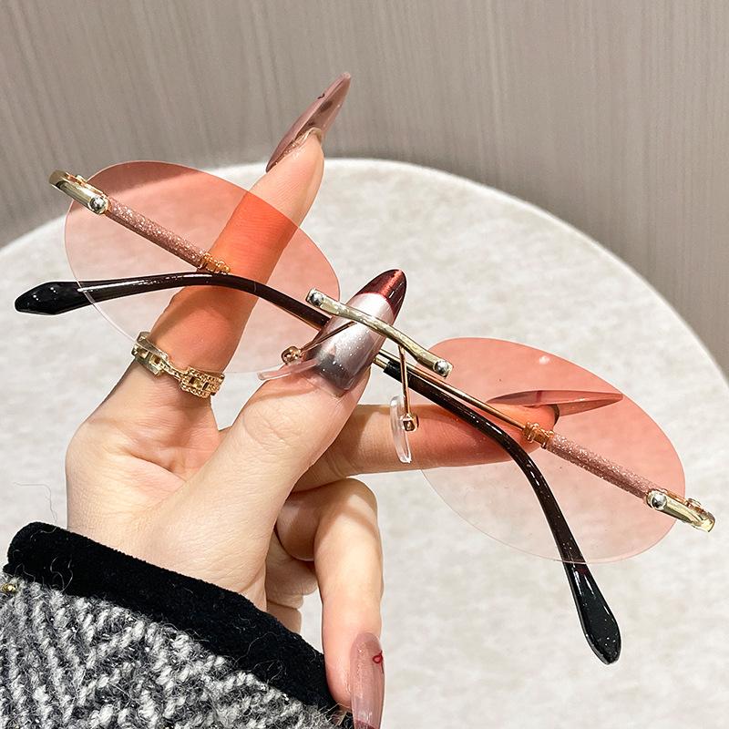 New Fashion Women'S Oval Metal Sunglasses Trendy Frameless Cut Edge Small Circular Eyeglasses Uv Protection Eyewear