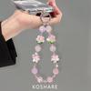 Peach blossom flash messenger mobile phone chain light luxury high-end crystal hanging chain fashionable anti-drop hand carry pendant female beads