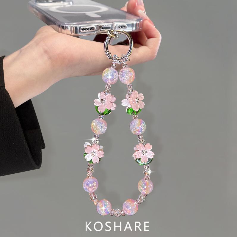 Peach blossom flash messenger mobile phone chain light luxury high-end crystal hanging chain fashionable anti-drop hand carry pendant female beads
