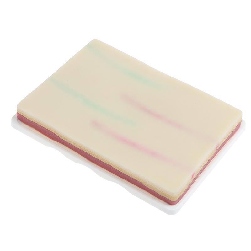 Модель для отработки навыков венепункции. Силиконовая учебная модель для наложения швов на кожу человека.