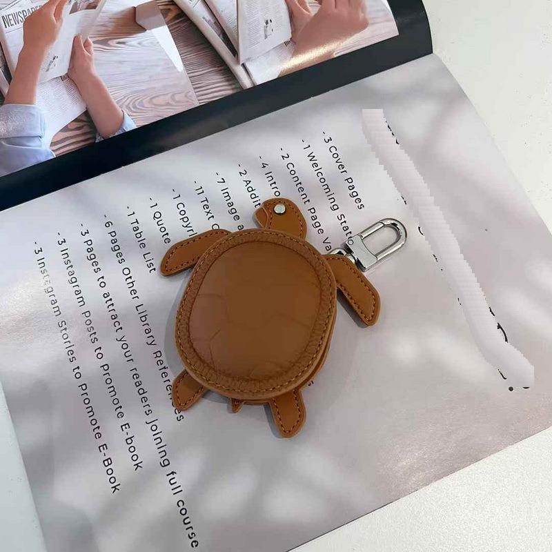 2025 Новый кожаный кулон Head Layer кожаный мини-кошелек для наушников Черепаха кулон Cross Border