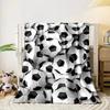 The main pattern is a dense arrangement of black-and-white soccer balls. for all seasons blanket lunch break throw gift
