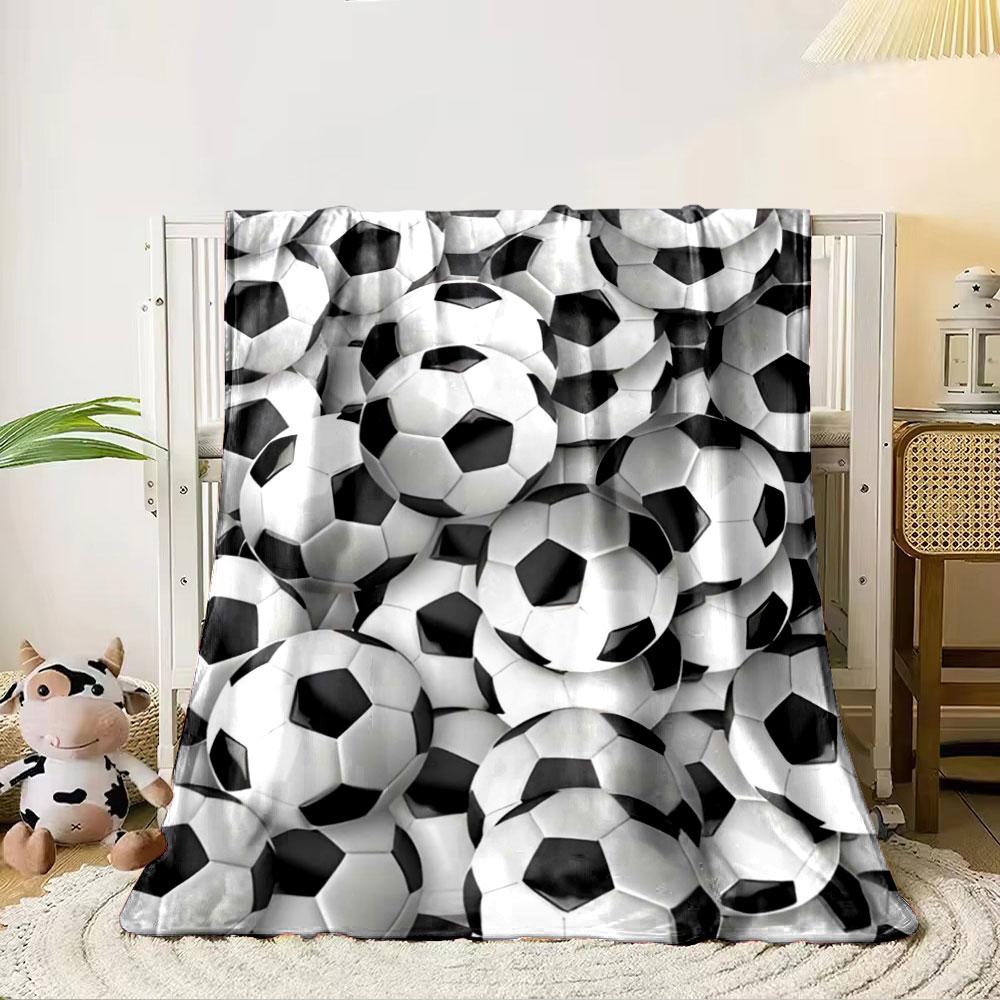 The main pattern is a dense arrangement of black-and-white soccer balls. for all seasons blanket lunch break throw gift