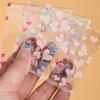 100Pcs Valentine's Day Self Adhesive Plastic Bags Stylish Clear Bags with Love Motif for Candy and Gift Packaging
