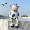 Resin Animal Statue Cow Statue Cute Shelf Sitter Figurine with Dangling Rope Legs Whimsical Courtyard Cartoon Farmhouse Ornament for Fence Railing