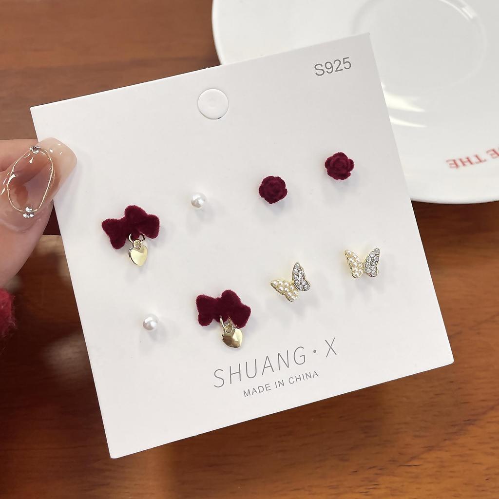 «Изысканные серьги-флок с бантом»: Элегантный и милый дизайн ниши для осени/зимы"