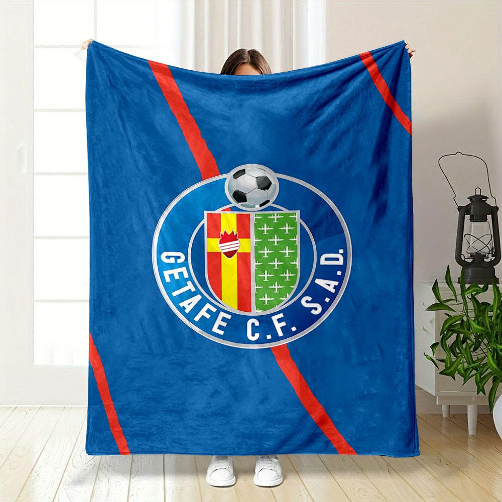 A blue background with red diagonal lines and a football club crest. for all seasons blanket lunch break throw gift