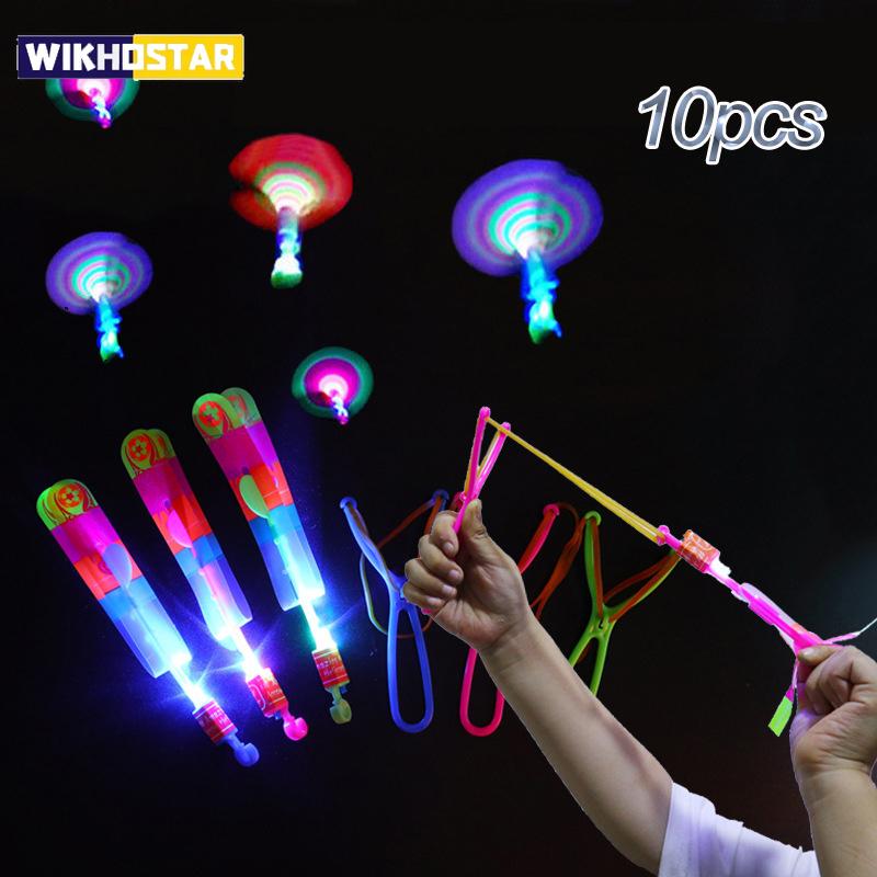 10pcs Amazing Light Toy Arrow Rocket Helicopter Flying Toy LED Light Toys Party Fun Gift Rubber Band Catapult