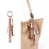 Ретро брелок с кисточкой, бусинами из натурального дерева и бантом