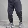 Men's Youth Waterproof Outdoor Hiking Pants - Three-Bar Design, Handsome and Loose Fit, Suitable for Spring and Autumn.