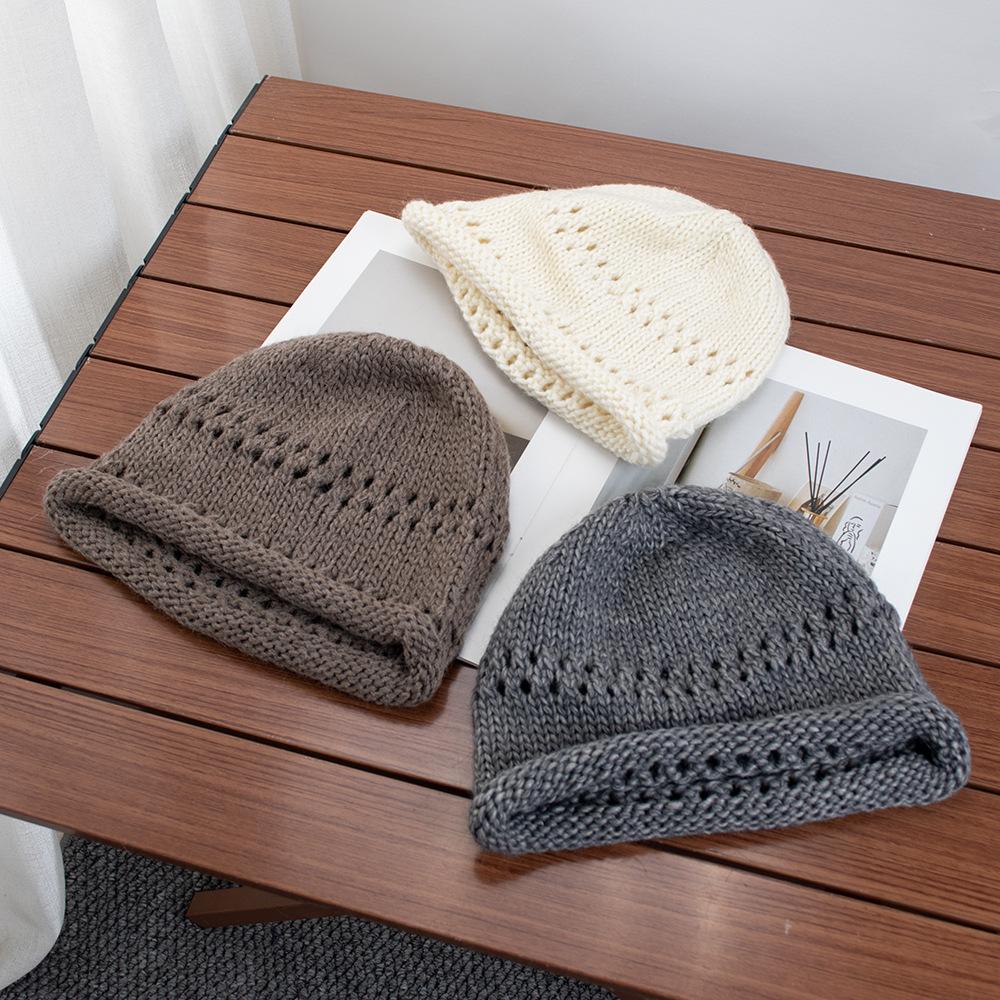 Solid color crimped hollow knitted headgear women's autumn new versatile wool hat loose pullover cold hat