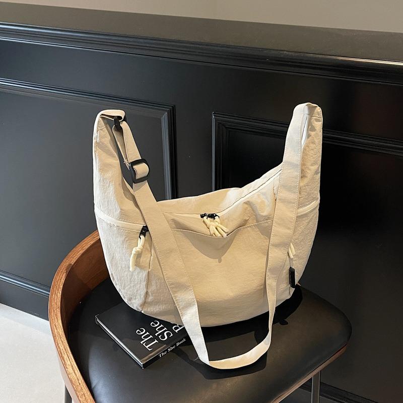 Сумка большой вместимости женская летняя новая нишевый дизайн сумка через плечо и кроссбоди простая通勤 сумка-пельмень