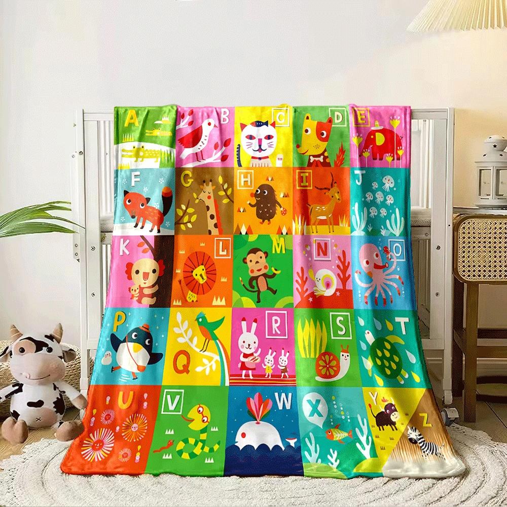 The pattern features alphabet letters paired with illustrated animals. for all seasons blanket lunch break throw gift
