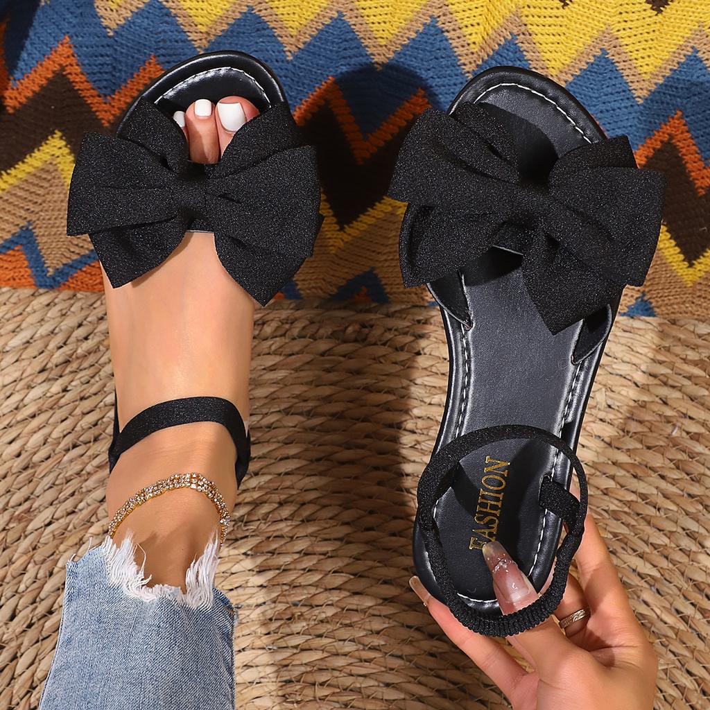 Модные женские сандалии 2025 Новые Пляжные каникулы Модная обувь Повседневные Универсальные Плоские Римские сандалии Женские Милый Бантик Дизайнерские Плоские сандалии
