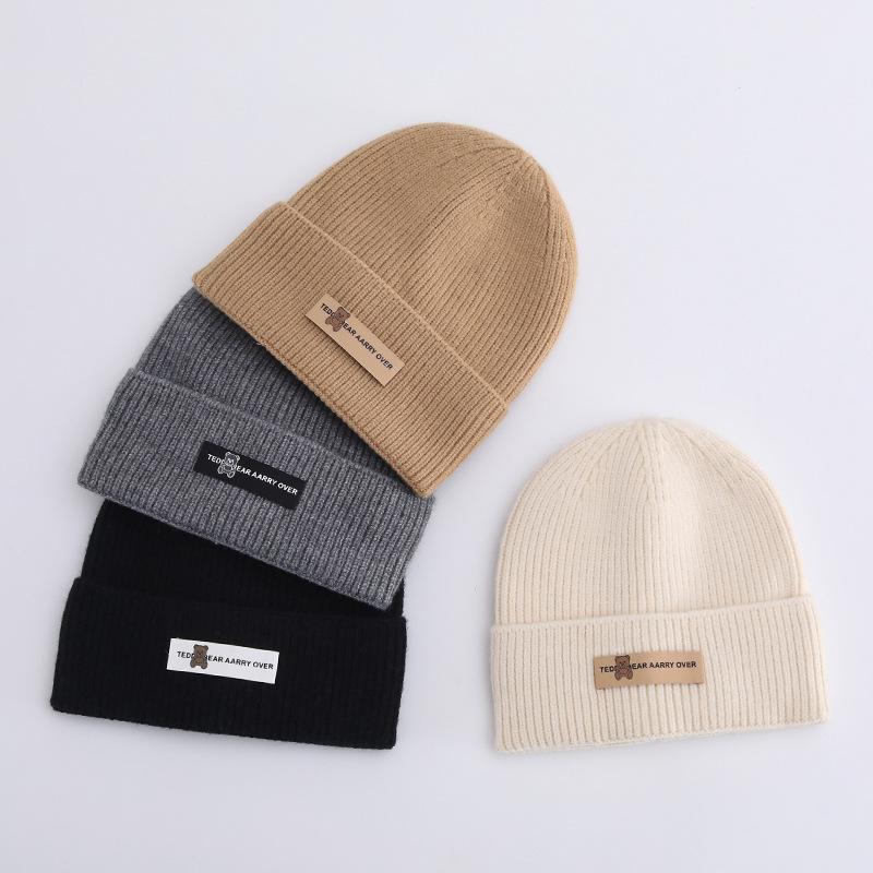 Осенние и зимние шапки женские плюшевые новые вязаные шапки универсальные теплые защитные наушники шерстяные утолщенные модные студенческие шапки