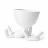 Decorative white pot for plants, lying reader, stylish