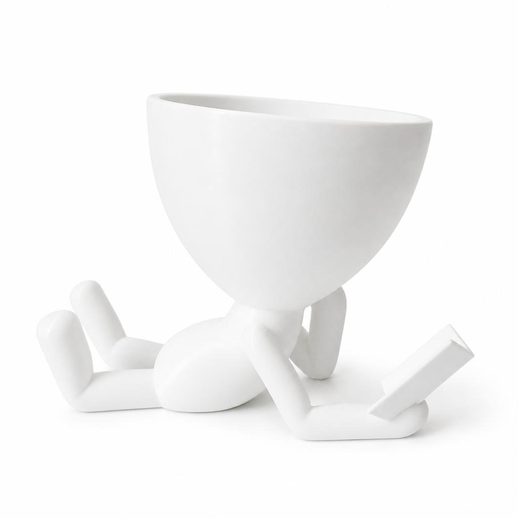Decorative white pot for plants, lying reader, stylish