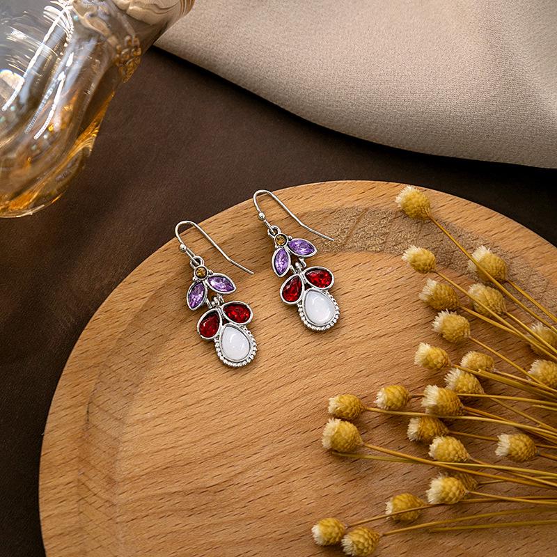 "European & American Retro Turquoise Feather Earrings: Bohemian Dragonfly, Bird, Water Drop, Round, & Pearl Designs"