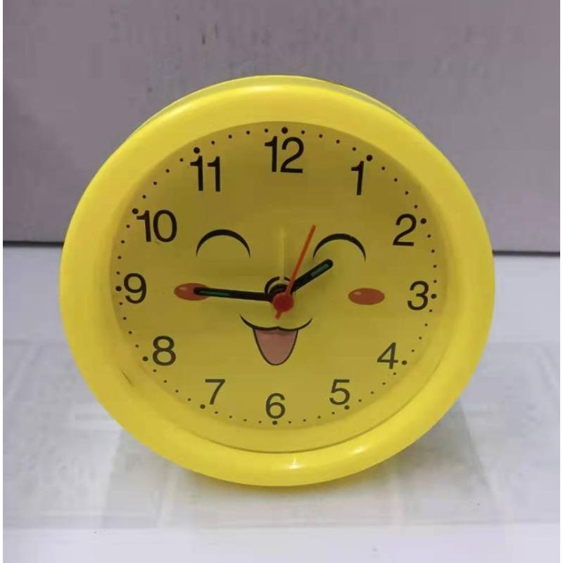 Round, Multiple Smiling Faces and Small Alarm Clock