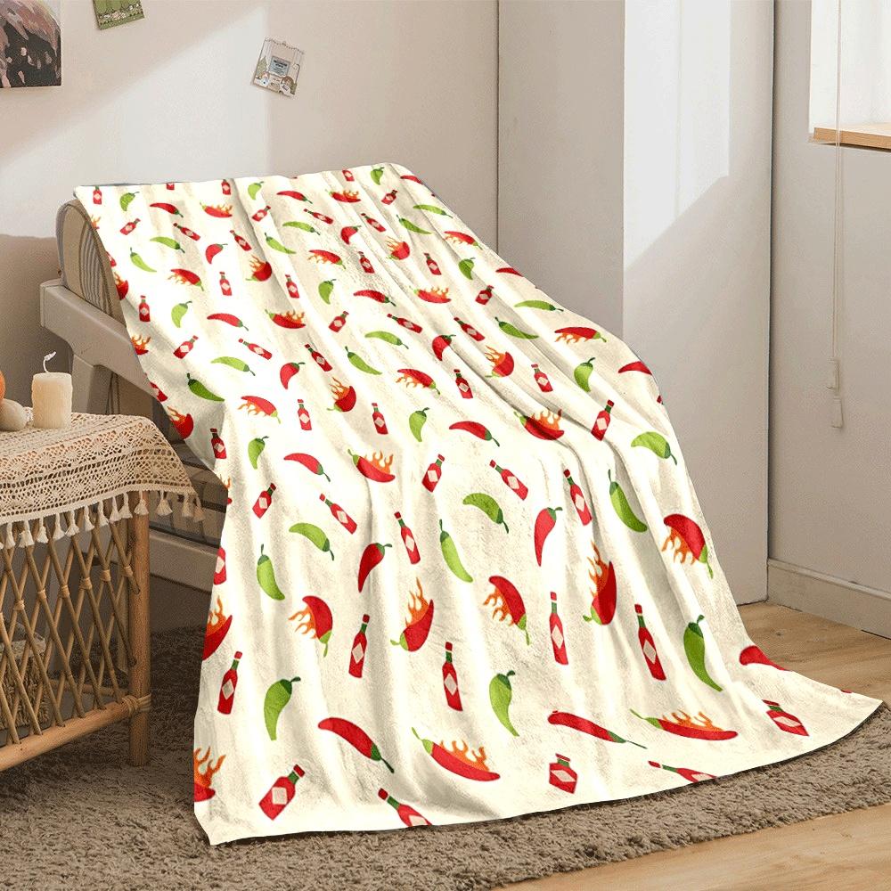 The pattern shows chilies, hot sauce bottles, and flaming chili peppers. for all seasons blanket lunch break throw gift