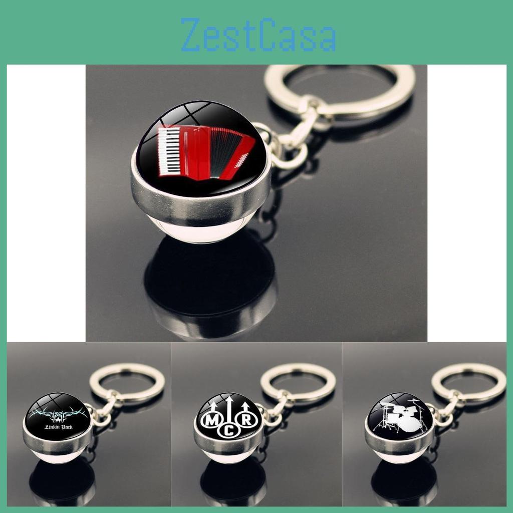 Элегантный брелок с рисунком барабана и двойной подвеской в виде стеклянного шара - идеальный подарок для любителя музыки