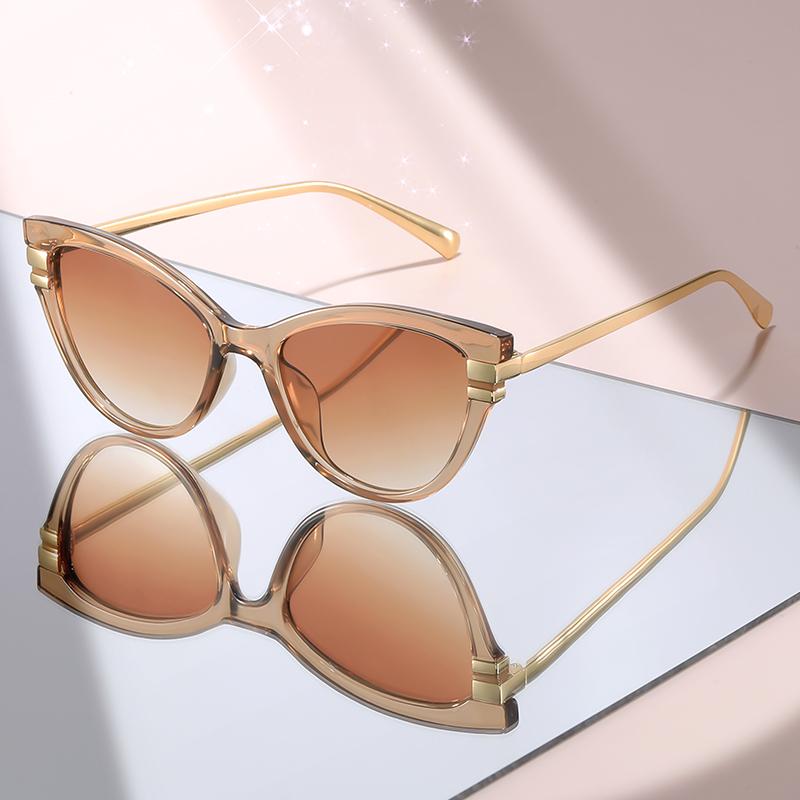 New Fashion Cat Eye Sunglasses with Black Top Frame, Red Patterned Lower Frame, Gold Metal Arms, and Gradient Brown Lenses for