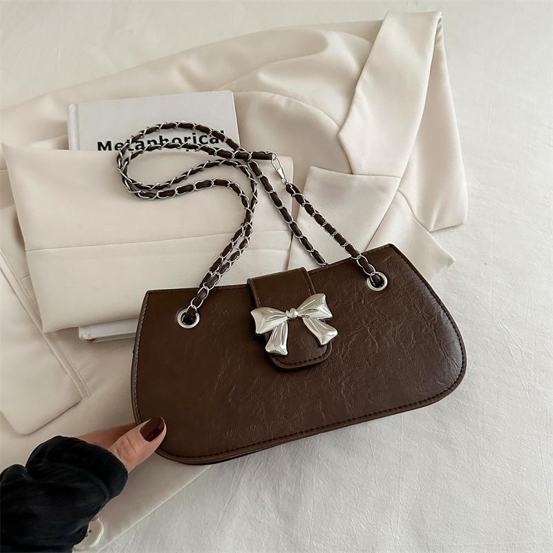 Модная корейская версия однотонная сумка подмышку, сумка-бант в иностранном стиле, женская новая красивая сумка-мессенджер на цепочке 2024