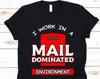 I Work In A Mail Dominated Environment Shirt, Postal Worker Gift For Mailman Or Mailwoman, Postman, Postal Carrier, Funny Rural Carrier