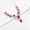 Gessen Jewelry: Элегантный набор: серьги, кольцо и подвеска с красными цирконами