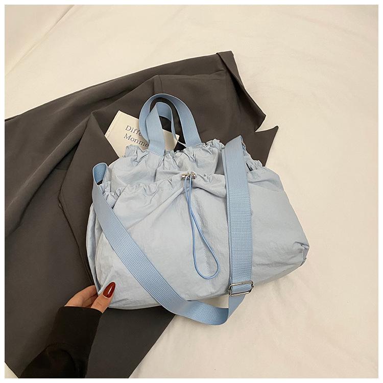 2025 Japanese Hansen Lazy Wind Canvas Bag Women's Large Capacity Drawstring Handbag High Value College Student Class Bag