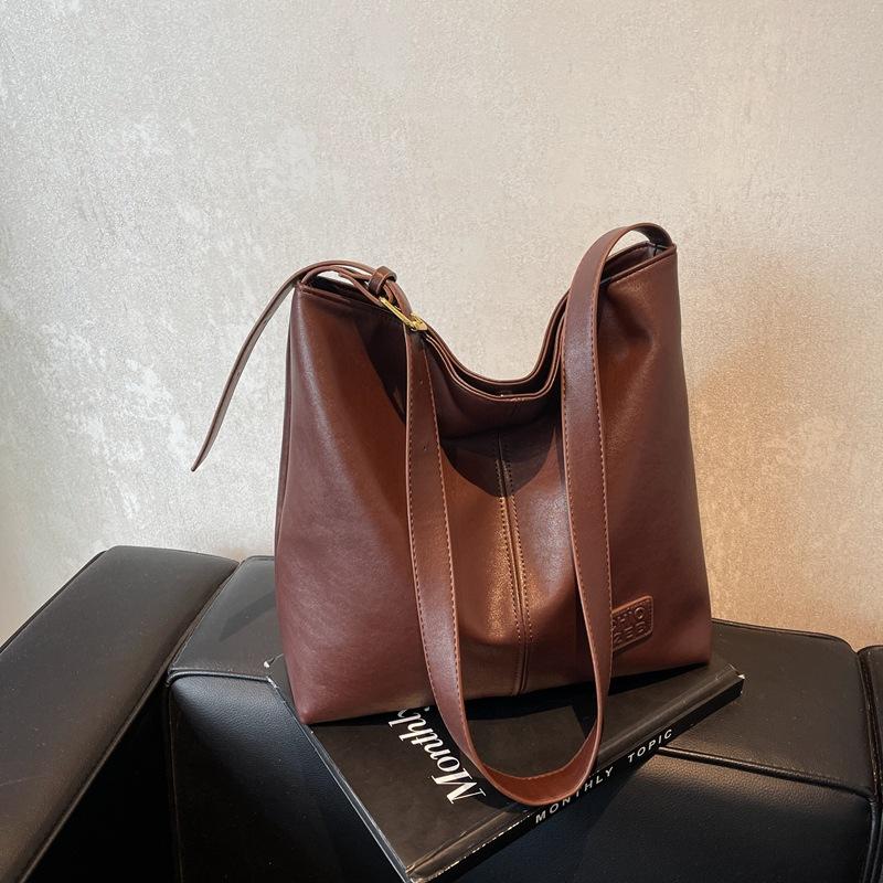 Премиальный стиль Новая осенне-зимняя сумка-ведро большой вместимости Премиальный стиль Нишевая наплечная сумка-подмышка Сумка-тоут