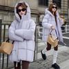 Модное пуховое хлопковое хлопковое пальто средней длины для женщин с юбкой с капюшоном и утолщенным хлопковым пальто