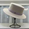 2026 Fine grass woven flat hat women's outing, British style topper women's beach vacation, versatile sun hat