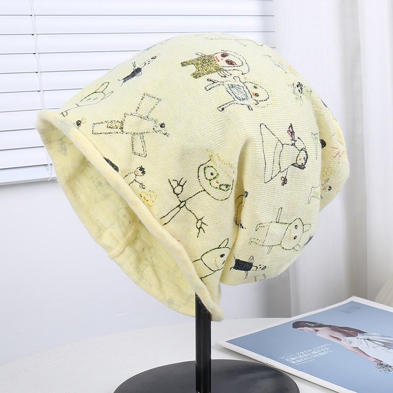 Source cartoon graffiti printing stack hat female autumn and winter warm literary cold hat casual bag head hat