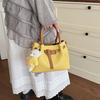 Color matching handbag with bear pendant messenger bag