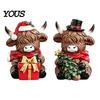 Decorative Sitting Cow Figures Christmas Highland Figurine, Resin Holiday Statue with Santa Hat & Colorful Festive Tabletop Ornaments Gift Box,