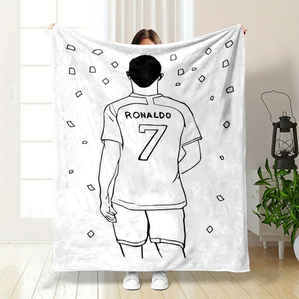 A person wearing a jersey labeled "RONALDO" with "7" surrounded by confetti. for all seasons blanket lunch break throw gift