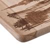 Wooden chopping board engraved with a boat on a lake