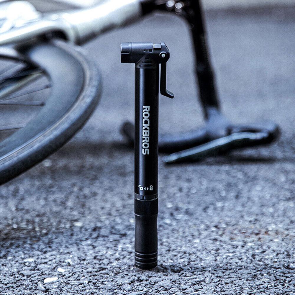 Small hand-held bicycle pump with bicycle frame holder + screwdriver - black