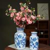 Blue & White Hand-Painted Porcelain Vase: Elegant Ceramic Ornament for Living Room or Entryway.
